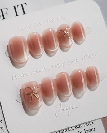 Glowing Blush press-on nails — Transparent Blush Cat Eye, Simple Silver Bow Outline. handmade nail art by Joyee Nails