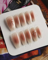 Glowing Blush press-on nails — Transparent Blush Cat Eye, Simple Silver Bow Outline. handmade nail art by Joyee Nails