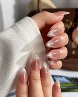 Glowing Blush press-on nails — Transparent Blush Cat Eye, Simple Silver Bow Outline. handmade nail art by Joyee Nails