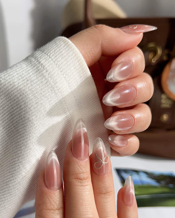 Glowing Blush press-on nails — Transparent Blush Cat Eye, Simple Silver Bow Outline. handmade nail art by Joyee Nails