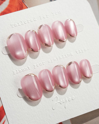 Glowing Stone - New Edition press-on nails in extra short oval shape — Gentle Rose Cat Eye, Simple Silver Outlines.
