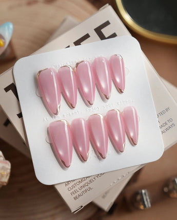 Glowing Stone - New Edition press-on nails in medium stiletto shape — Gentle Rose Cat Eye, Simple Silver Outlines.