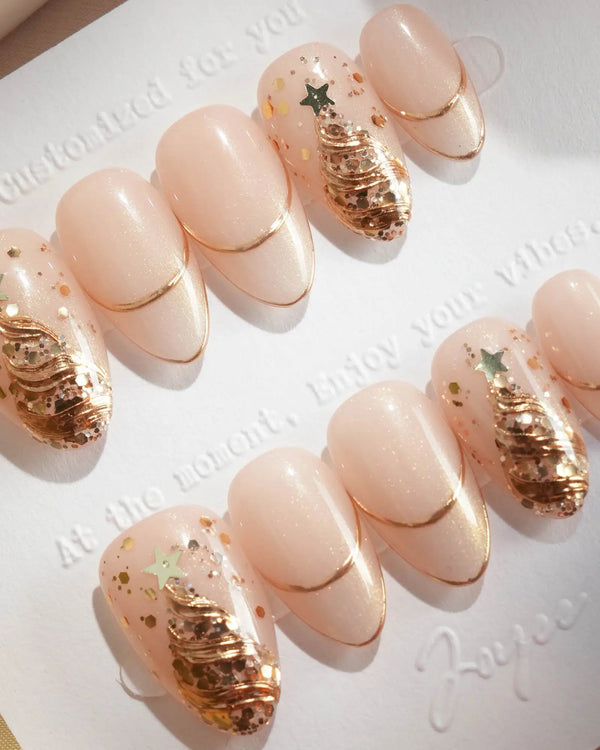 Gold French Christmas nails with nude base and tree design