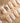 Beach-inspired gold and pearl nail art