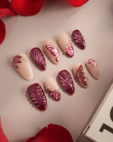 Velvet Flow press-on nails with sultry red shimmer, glossy gel and sculpted butterfly accents