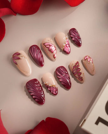Velvet Flow press-on nails with sultry red shimmer, glossy gel and sculpted butterfly accents