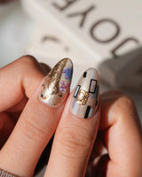 Golden Kiss custom size press-on nails in medium almond with Klimt-style gold details