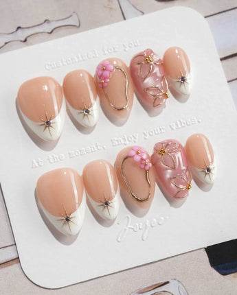 Golden Tide gold French tip floral press-on nails in extra short almond shape