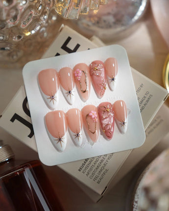Golden Tide gold French tip floral press-on nails in medium stiletto shape