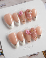 Golden Tide gold French tip floral press-on nails in short almond shape