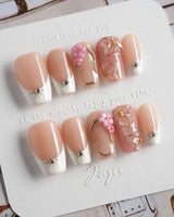 Golden Tide gold French tip floral press-on nails in short coffin shape