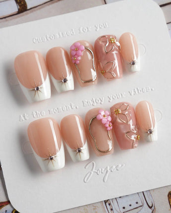 Golden Tide gold French tip floral press-on nails in short coffin shape