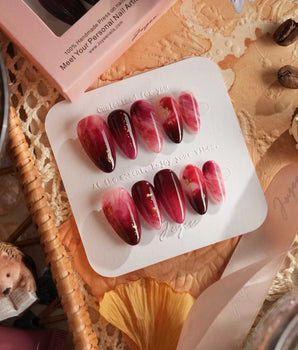 Gone with the Wind handmade press-on nails featuring Marbled Burgundy, Gold Foil Accents.