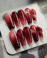 Gone with the Wind long coffin press-on nails with burgundy marble and gold foil details