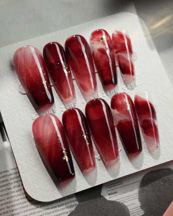 Gone with the Wind long coffin press-on nails with burgundy marble and gold foil details