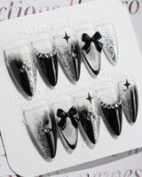 Gorgeous Gown press-on nails in medium stiletto shape — black white gradient rhinestone bow y2k nails