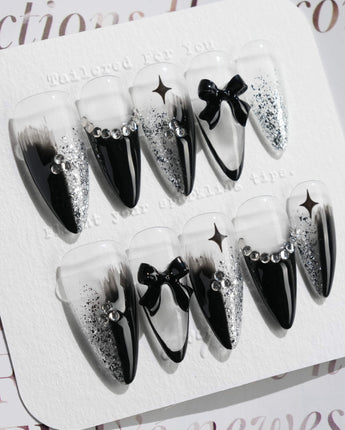 Gorgeous Gown press-on nails in medium stiletto shape — black white gradient rhinestone bow y2k nails