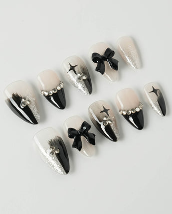 Gorgeous Gown press-on nails in short stiletto shape — black white gradient rhinestone bow y2k nails