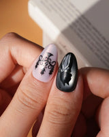 Gothic Dollhouse pink goth press on nails with a black candelabra, silver mirror, crosses, 3D gold roses and a skull on pink and black - image 5