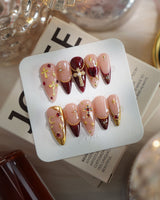 Gothic Red medium stiletto press-on nails with 3D metallic crosses and burgundy red details