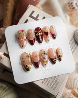 Gothic Red short almond press-on nails with deep red and burgundy fall nail art
