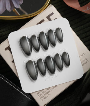 Graphite press on nails in smoky grey glossy jelly with a hand-drawn silver chrome outline - image 2