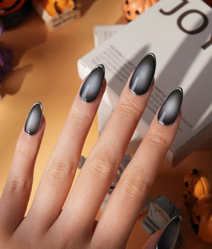Graphite press on nails in smoky grey glossy jelly with a hand-drawn silver chrome outline - image 1