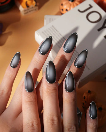 Graphite press on nails in smoky grey glossy jelly with a hand-drawn silver chrome outline - image 3