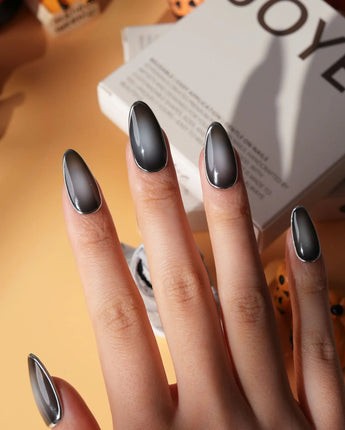 Graphite press on nails in smoky grey glossy jelly with a hand-drawn silver chrome outline - image 4