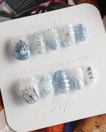 Great Barrier Blue close-up of metallic shell carvings and high-shine pearl accents