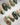 Green Christmas press-on nails with bow and snowflake details