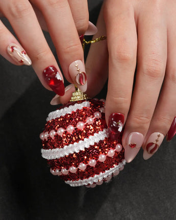 Sweet Bite nail art close-up showing Deep Red & Nude Pink, Cat-eye Finish, Hand-painted Red Hearts & Metallic Lines. details