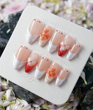 Duchess Marigold handmade nails with sculpted marigold orange flowers and nude French base