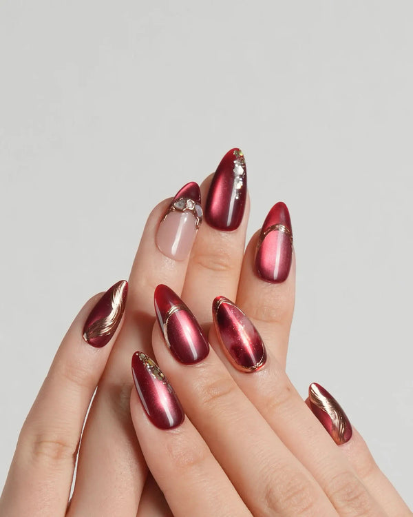 Handmade red ombre nails with gold accents