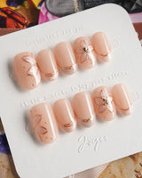 Haze Bloom press-on nails — Elegant Nude Pink, Embossed Florals & French Gold Edging. handmade nail art by Joyee Nails