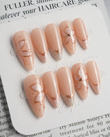 Haze Bloom press-on nails — Elegant Nude Pink, Embossed Florals & French Gold Edging. handmade nail art by Joyee Nails