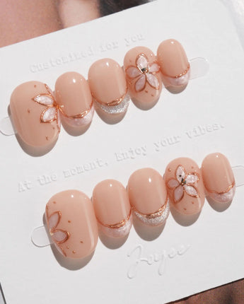 Haze Bloom press-on nails — Elegant Nude Pink, Embossed Florals & French Gold Edging. handmade nail art by Joyee Nails
