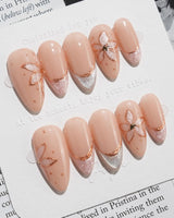 Haze Bloom press-on nails — Elegant Nude Pink, Embossed Florals & French Gold Edging. handmade nail art by Joyee Nails