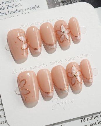 Haze Bloom press-on nails — Elegant Nude Pink, Embossed Florals & French Gold Edging. handmade nail art by Joyee Nails