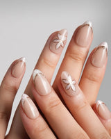 Haze Bloom handmade press-on nails featuring Elegant Nude Pink, Embossed Florals & French Gold Edging.