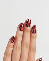 Heart Collector press-on nails in short oval shape — Vintage Red Pear, Contrasting Red & White Hearts, Cat-eye Shimmer