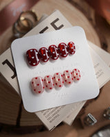 Heart Collector press-on nails in extra short oval shape — Vintage Red Pear, Contrasting Red & White Hearts, Cat-eye Shimmer