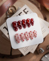 Heart Collector press-on nails in short almond shape — Vintage Red Pear, Contrasting Red & White Hearts, Cat-eye Shimmer