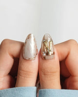 High Tea close-up of gold tableware charms on glossy medium almond nails