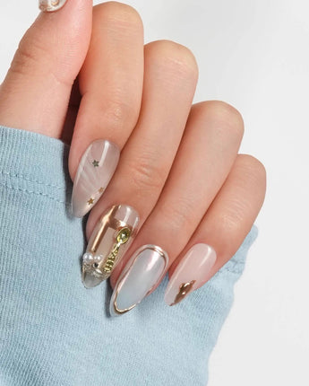 High Tea glossy tearoom-inspired nail set with warm nude, mint, and gold accents