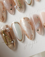 High Tea medium almond nails with nude-to-mint base and gold cutlery charms