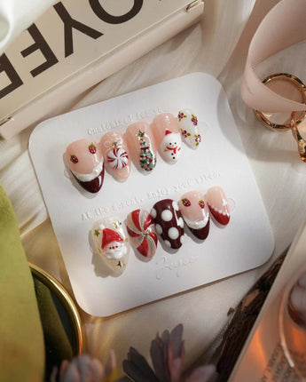 Holiday Party press-on nails in extra short almond shape — pearl nude cat eye snowflake bow silver glitter soft sheen