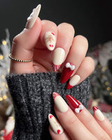 Holy night nail art close-up showing Festive Christmas, Gingerbread Man & Hearts. details
