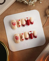 Holy night press-on nails in short oval shape — Festive Christmas, Gingerbread Man & Hearts.