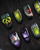 Poison Apple press on nails with a green skull poison apple, fanged grin, bat and 3D silver crown on green and purple cat eye - image 1